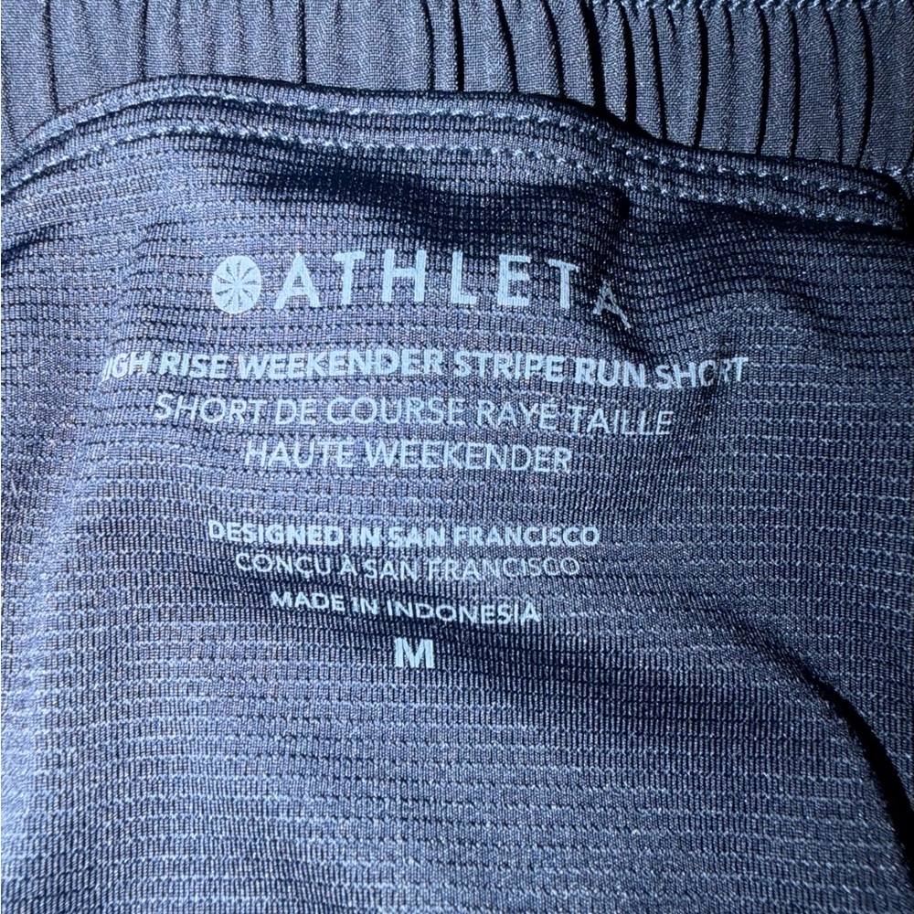 Athleta Weekender high rise 3” Navy Shorts with lime green Trim - Picture 3 of 4